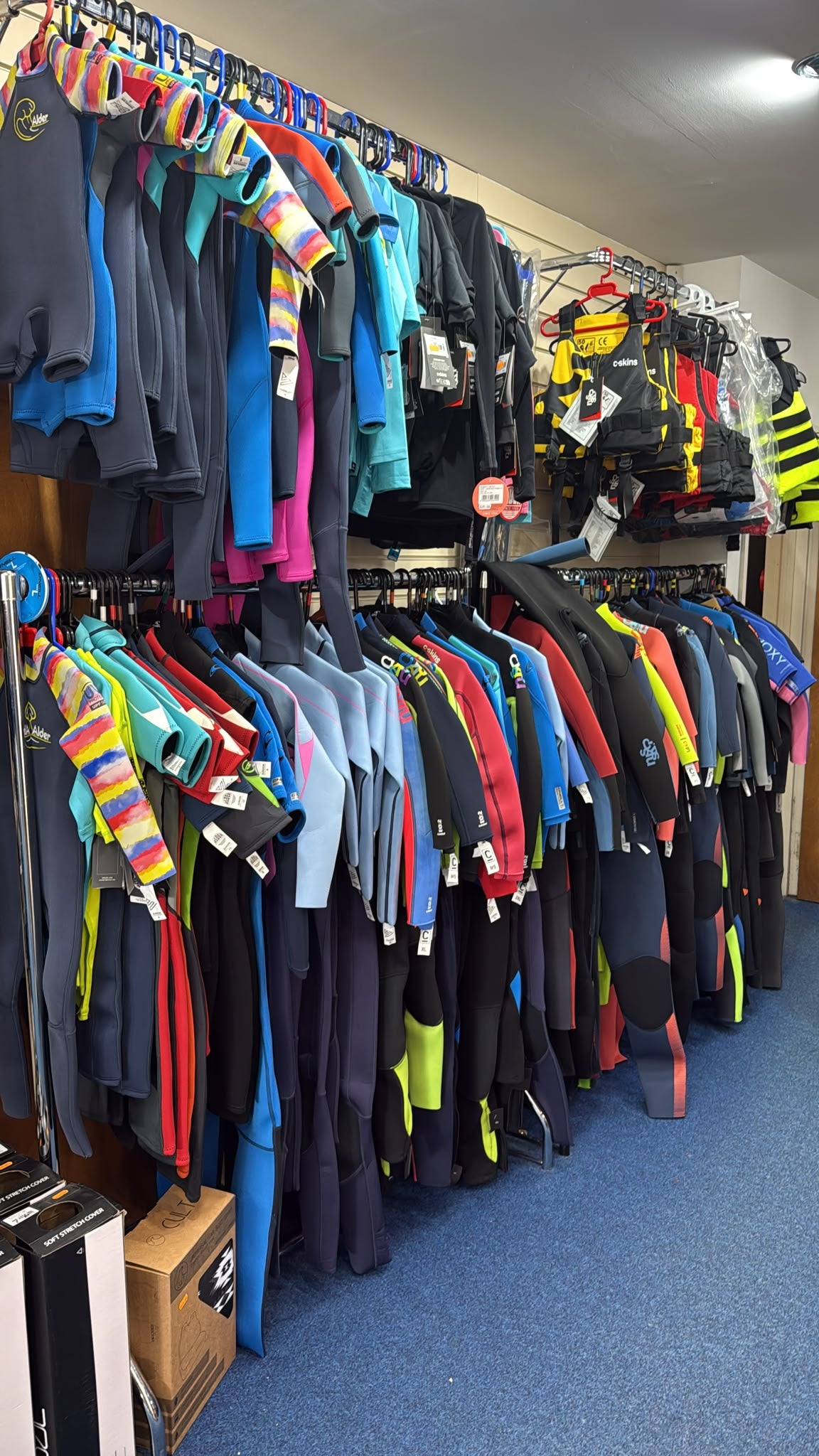 Selection of cskins, oneill, roxy and alder wetsuits at Hot Dog Surf Shop in Gower
