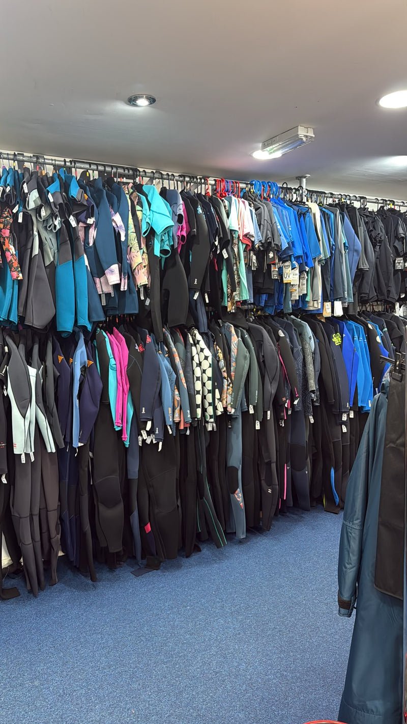 Selection of cskins, oneill, roxy and alder wetsuits at Hot Dog Surf Shop in Gower